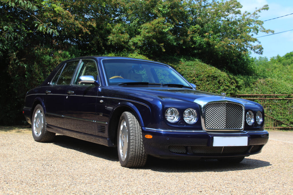 Dark blue bentley arnage with trees in background