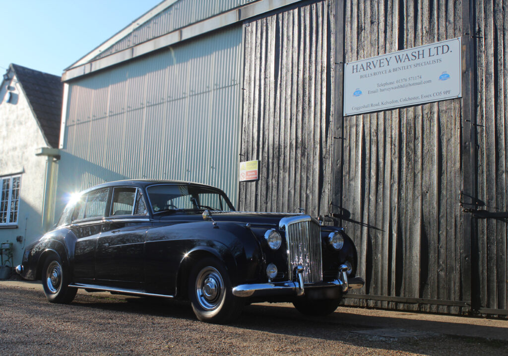 Bentley S2 in dark blue, outside the Harvey Wash ltd workshop