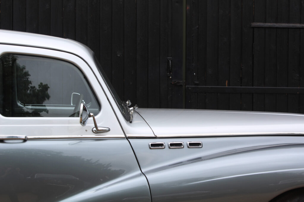 side profile of grey classic sunbeam with drivers door and front wing