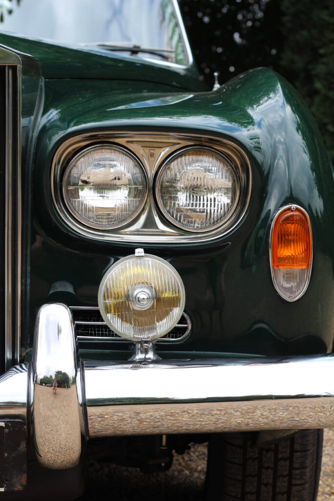 Front view of left hand headlights on a green Rolls Royce Silver cloud