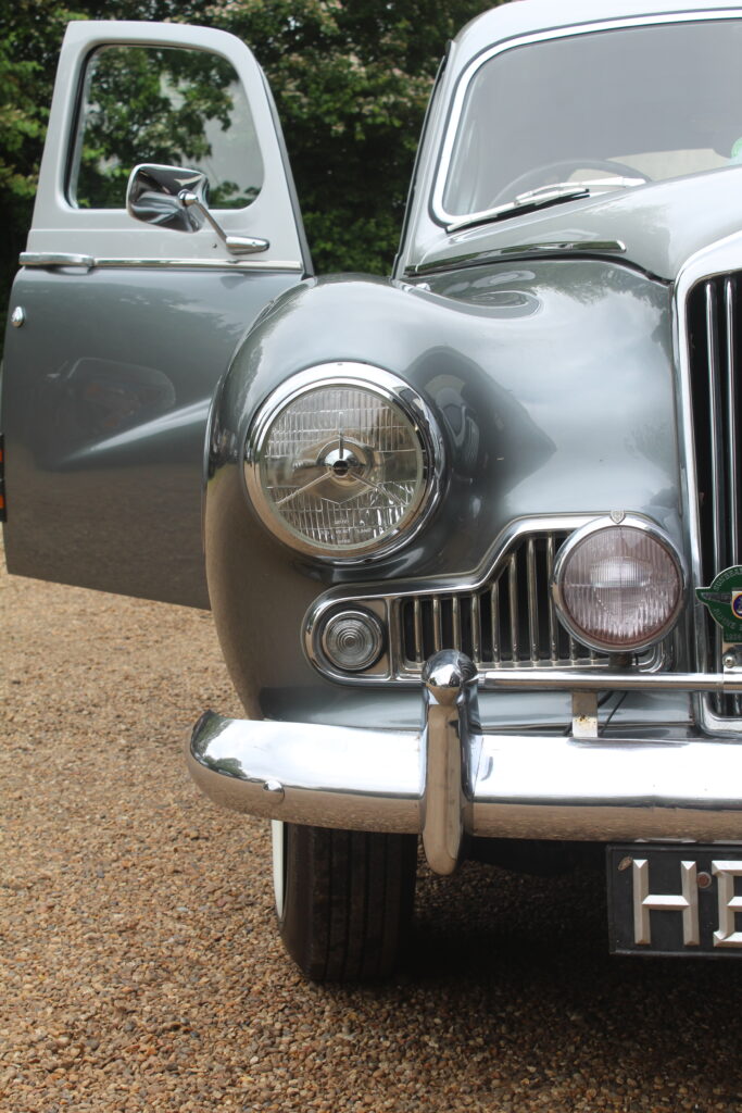 front half view of classic sunbeam car with drivers door open 