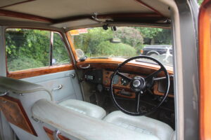 Rolls Royce Silver Dawn front dash and sterring wheel view from front seat.