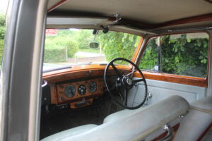 Rolls Royce Silver Dawn front dash and sterring wheel view from front seat.