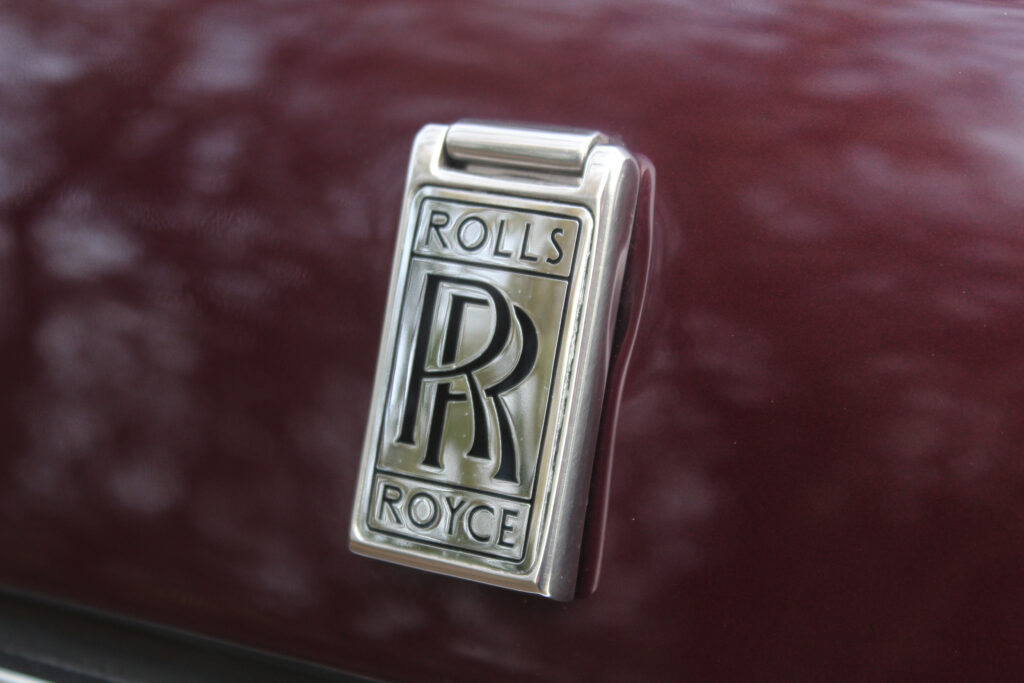 Rolls royce badge on wild berry car