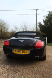 rear view of black bentley gtc